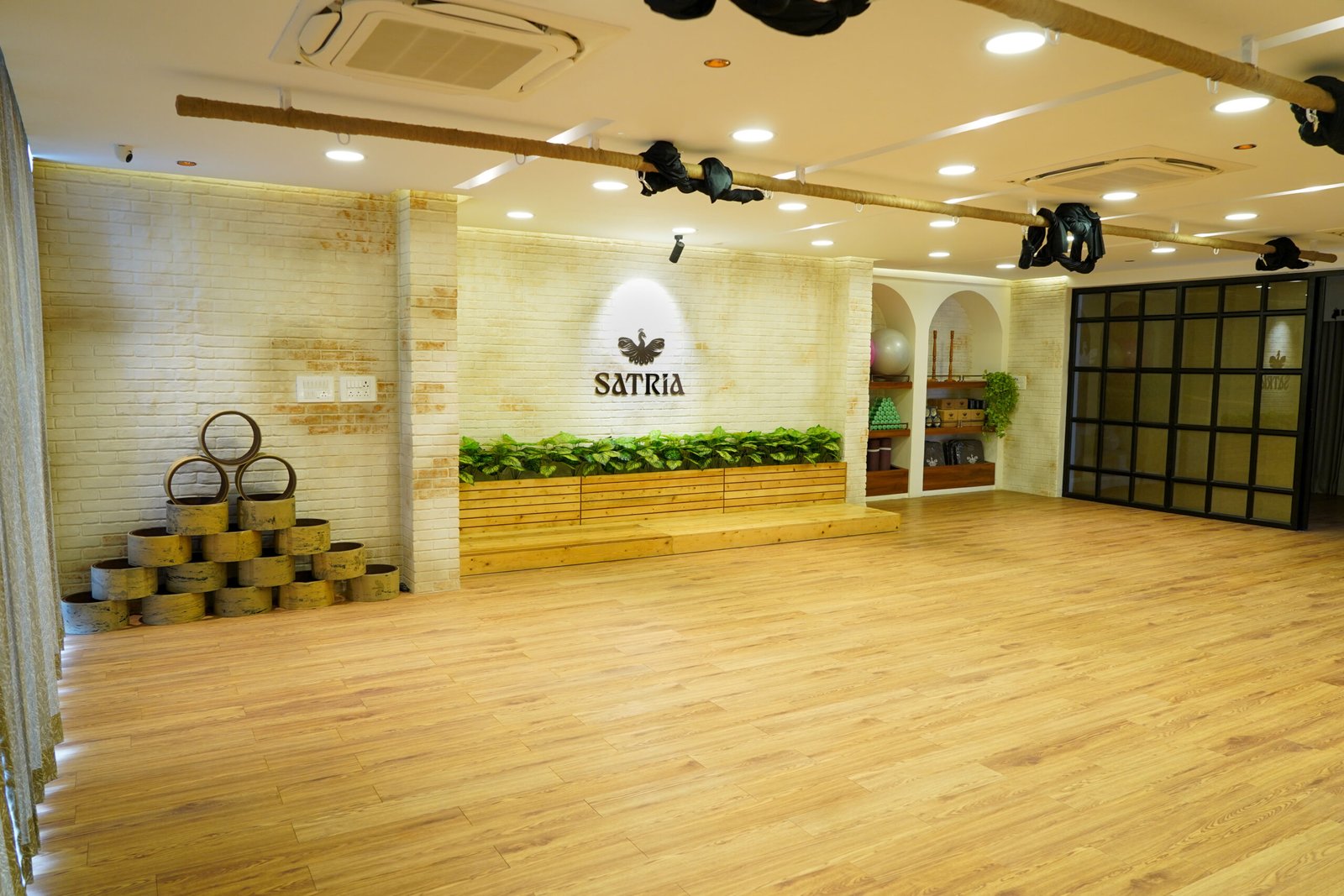 Spacious interior of Satria Studio in Adyar with wooden flooring