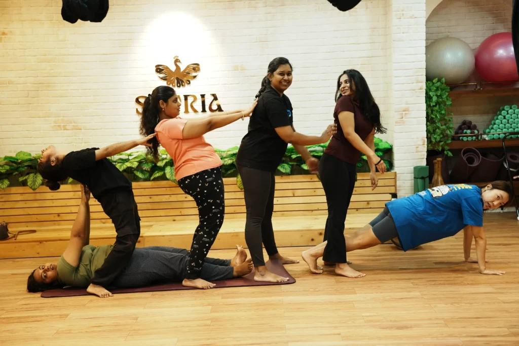 Women practicing seated stretching during a yoga class