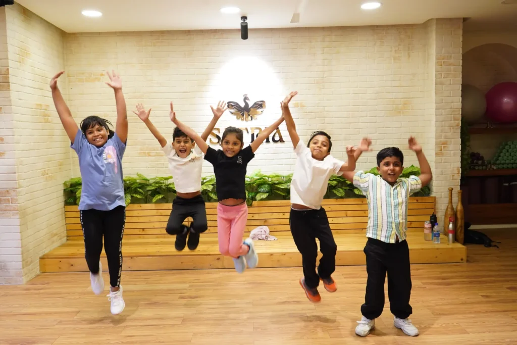 Kids activity group with instructor inside Satria Studio