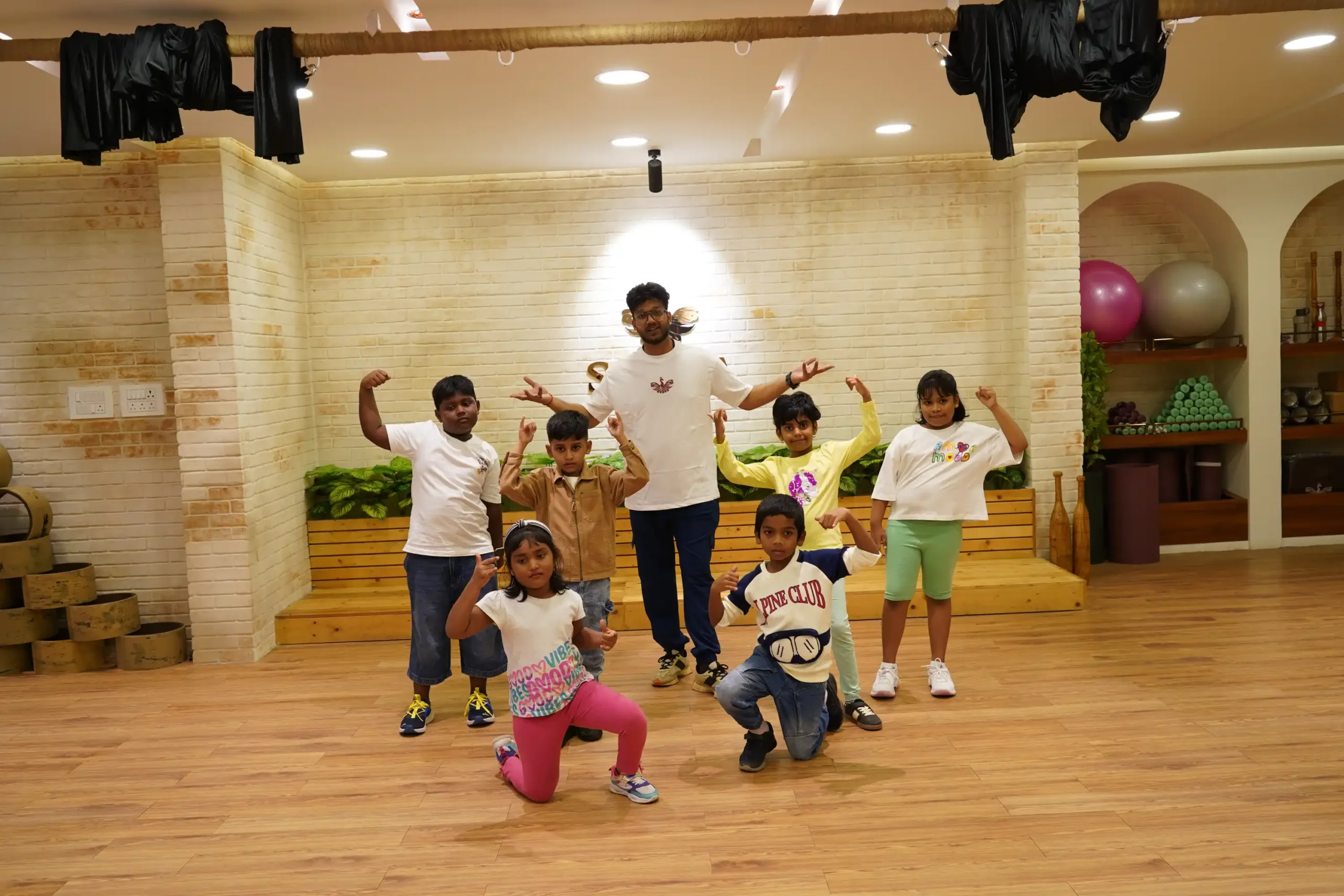 Children posing together inside Satria Studio