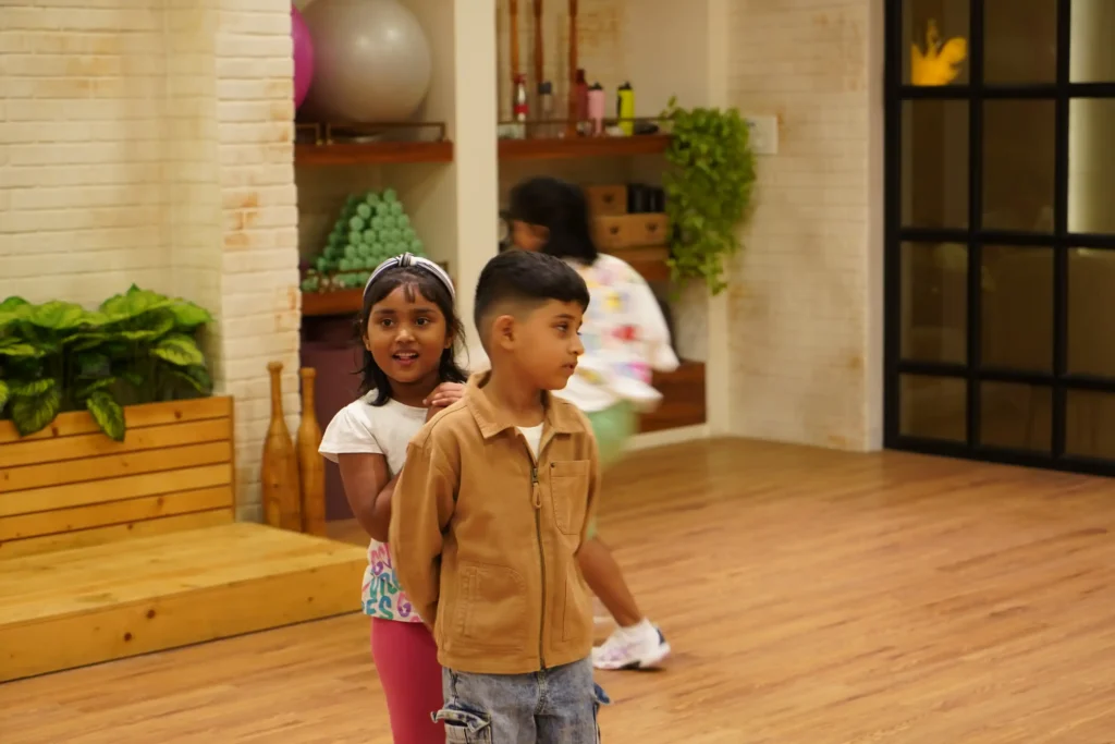 Children participating in an indoor activity at Satria Studio